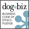 A blue and white logo for the dog biz.